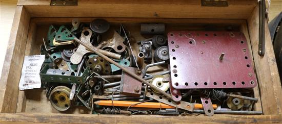 A collection of early Meccano including small parts tins, etc,